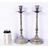 A pair of Middle Eastern candle sticks. 30cm (2).