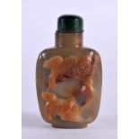 A 19TH CENTURY CHINESE CARVED AGATE SNUFF BOTTLE AND STOPPER Qing, decorated with buddhistic