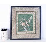 A Chinese framed silk depicting a bird in foliage. 32 x 29cm.