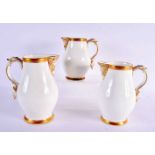 A GRADUATED SET OF THREE 19TH CENTURY ENGLISH PORCELAIN JUGS. Largest 20 cm x 12 cm. (3)