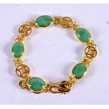 A CHINESE REPUBLICAN PERIOD 22CT GOLD AND JADEITE BRACELET. 16.9 grams. 19 cm long.