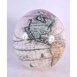 AN UNUSUAL DECLOMANIA MAP OF THE WORLD OSTRICH EGG. 15 cm x 10 cm.