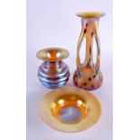 AN ART NOUVEAU IRIDESCENT GLASS VASE together with another ribbed vase & a dish. Largest 23 cm high.