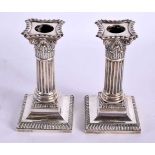 A PAIR OF EDWARDIAN SILVER CANDLESTICKS. Birminghan 1902. 942 grams overall. 15 cm x 7 cm.