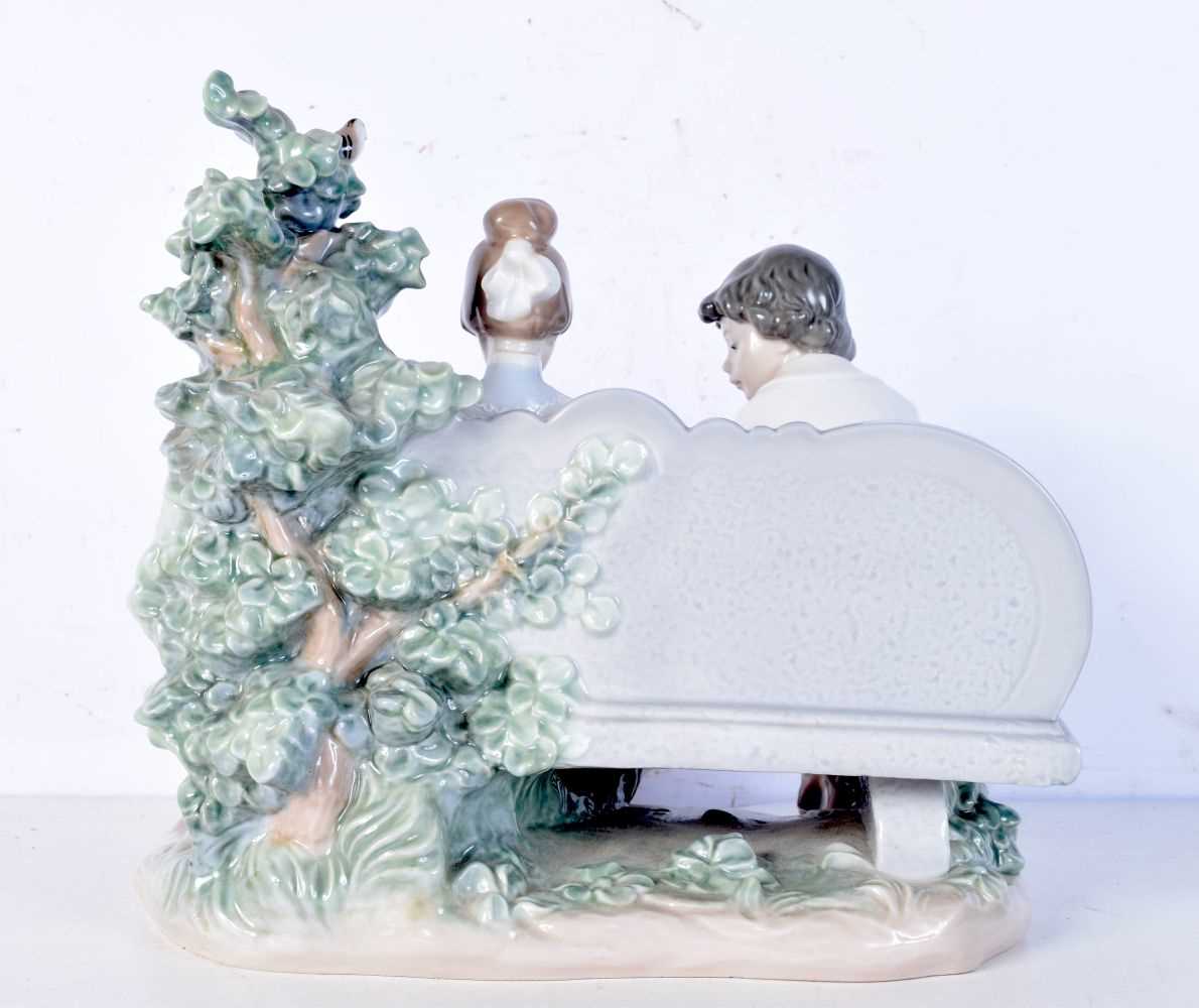 A Lladro group (5442) boy and girl on a bench. 24 x 24cm. - Bild 3 aus 6