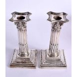 A PAIR OF EDWARDIAN SILVER CANDLESTICKS. Birminghan 1905. 1077 grams overall. 18 cm x 7 cm.