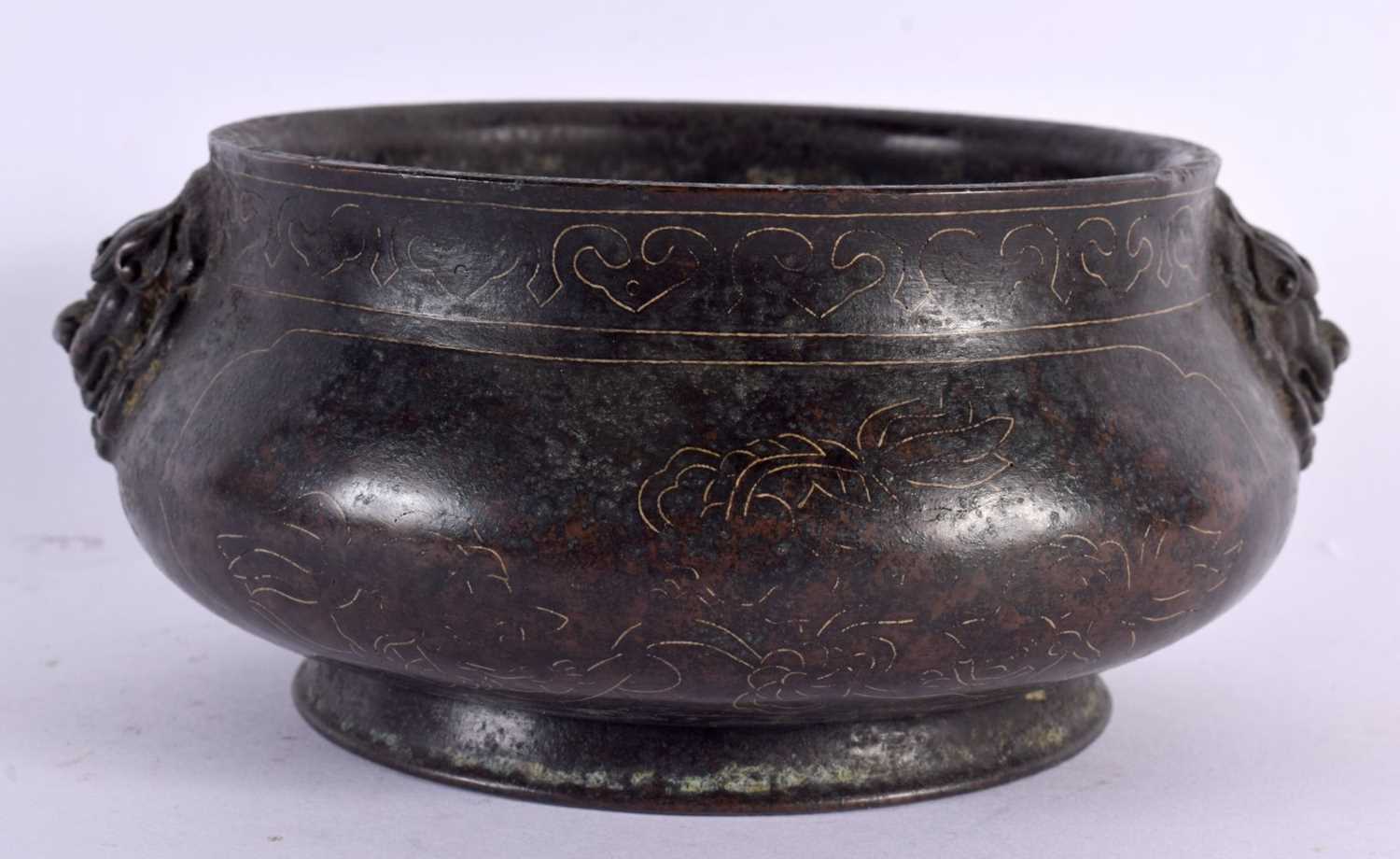 A CHINESE TWIN HANDLED BRONZE CENSER 20th Century, silver inlaid with landscapes. 17 cm wide,