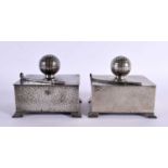 A PAIR OF ART DECO CIVIC PEWTER GOLFING CIGARETTE BOXES AND COVERS formed with clubs and balls. 11.5