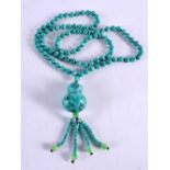 A CARVED TURQUOISE NECKLACE. 103 grams. 88 cm long.