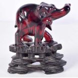 A 19TH CENTURY CHINESE CARVED CHERRY AMBER ELEPHANT Qing. 8.5 cm x 7.5 cm.