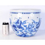 A large Chinese blue and white porcelain jardinière, painted with the eight immortals amongst the
