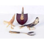 A collection of horn items including a Rhino horn spoon, plaque, fish, etc. 22cm (4).