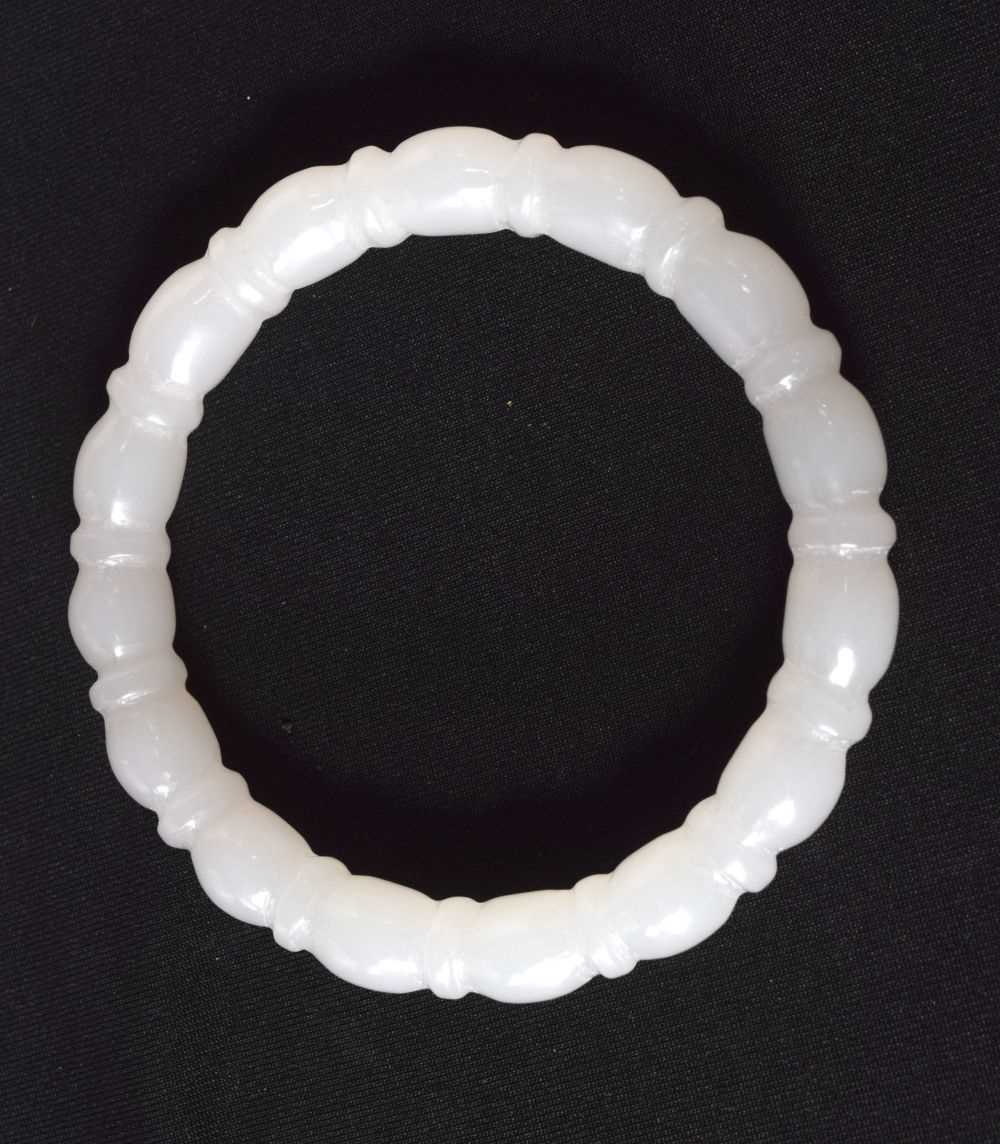 A CHINESE JADE BANGLE. 4.5 cm wide.