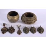 FIVE ASSORTED TRIBAL BRONZE MASKS together with two censers. (7)