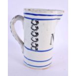 AN ANTIQUE FRENCH SPONGEWARE POTTERY MEASURING JUG. 18 cm x 12 cm.