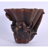 A CHINESE CARVED BUFFALO HORN TYPE LIBATION CUP 20th Century. 426 grams. 10 cm x 12 cm.