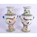 A PAIR OF EARLY 20TH CENTURY CHINESE FAMILLE ROSE PORCELAIN VASES Late Qing/Republic. 23.5 cm high.