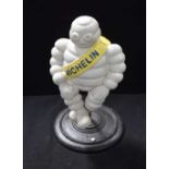 A CAST IRON MICHELIN MAN. 30 cm high.