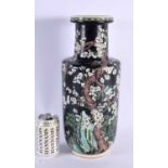 A LARGE 19TH CENTURY CHINESE FAMILLE NOIRE PORCELAIN ROULEAU VASE Kangxi style, painted with foliage