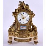 A 19TH CENTURY FRENCH SEVRES PORCELAIN INSET BRONZE MANTEL CLOCK painted with flowers. 32 cm x 18