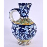 AN ITALIAN FAIENCE TIN GLAZED POTTERY EWER. 16 cm x 6 cm.