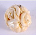 A JAPANESE CARVED BONE EROTIC BALL. 3.5 cm wide.
