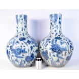 A large pair of blue and white porcelain vases decorated with fish. 59cm (2).