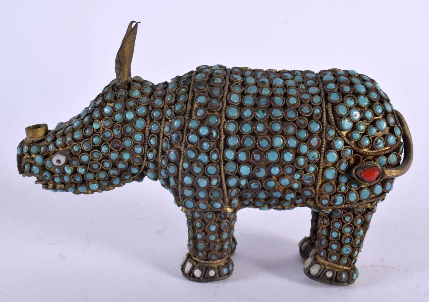 AN ANTIQUE TIBETAN TURQUOISE JEWELLED FIGURE OF A RHINOCEROS. 15 cm x 8 cm.