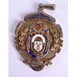 A SILVER AND ENAMEL MEDALLION PRESENTED TO THE CHAIRMAN OF THE JUNIOR SECTION OF THE NORTH