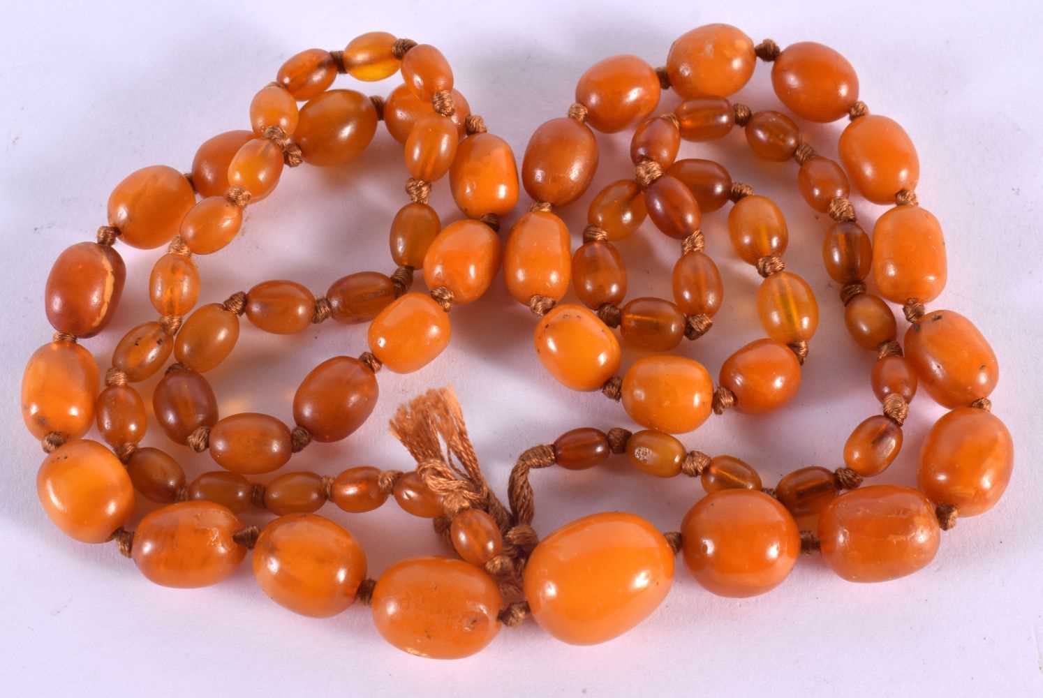 AMBER NECKLACE. Length 88cm, Largest Bead 14mm, weight 38g