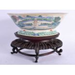 A MID 19TH CENTURY CHINESE FAMILLE ROSE LOBED QUATREFOIL FOOTED BOWL Daoguang, painted with a