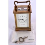 A MAPPIN & WEBB CARRIAGE CLOCK WITH ORIGINAL GUARANTEE AND KEY. 15cm high (handle extended) x 8cm