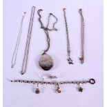 ASSORTED SILVER JEWELLERY INCLUDING A LARGE LOCKET ON A CHAIN, A PAIR OF EARRINGS, A LUCKY CHARM