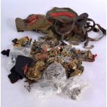 A MIXED LOT OF MILITARY INTEREST CONTAINING BADGES, BUTTONS, PATCHES AND OTHER ITEMS (Qty)