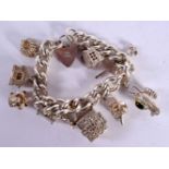 A HALLMARKED SILVER CHARM BRACELET WITH 10 CHARMS. Total weight 105g