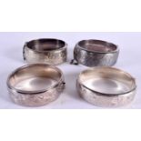 FOUR VINTAGE SILVER CUFF BRACELETS. VARIOUS HALLMARKS. Largest internal width 5.8cm, total weight