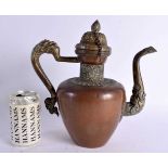 A LARGE 19TH CENTURY INDO PERSIAN TIBETAN COPPER AND BRASS EWER with embossed decoration to spout,
