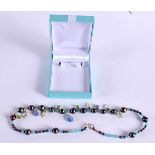 A CHARMING BEAD NECKLACE WITH GEMSTONE DROPS AND SPACERS. Length 44.5cm, weight 28.6g