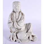 AN 18TH CENTURY CHINESE BLANC DE CHINE PORCELAIN FIGURE OF GUANYIN Qing, modelled resting upon an