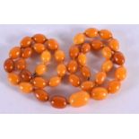 AMBER NECKLACE. Length 63cm, Largest Bead 14.5mm, weight 40g