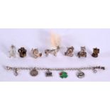 A SILVER CHARM BRACELET WITH 6 SMALL CHARMS TOGETHER WITH 8 LARGER SILVER CHARMS. Bracelet length