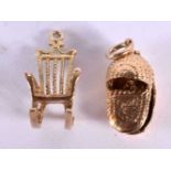 TWO 9CT GOLD CHARMS MODELLED AS A ROCKING CHAIR AND A MOSES BASKET. Largest 2.3cm, total weight 6.4g