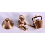 THREE 9CT GOLD CHARMS MODELLED AS A TEDDY BEAR, A KETTLE AND A BELL. Largest 2.7cm, total weight 5.