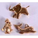 THREE 9CT GOLD CHARMS MODELLED AS A DOLPHIN, A TEDDY BEAR AND AN OWL. Largest 2.8cm, total weight