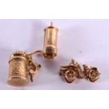 THREE 9CT GOLD CHARMS MODELLED AS A VINTAGE CAR, A POST BOX AND A GERMAN STEIN. Largest 1.8cm, total