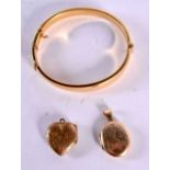 TWO 9CT GOLD LOCKETS TOGETHER WITH A ROLLED GOLD BANGLE. Internal diameter of Bangle 5.5cm. Total
