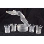 A FRENCH LALIQUE GLASS FIGURE OF A NUDE FEMALE together with four Lalique glass shot holders.