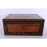 A LARGE LATE REGENCY AMBOYNA AND ROSEWOOD RECTANGULAR BOX decorated with a coronet and a