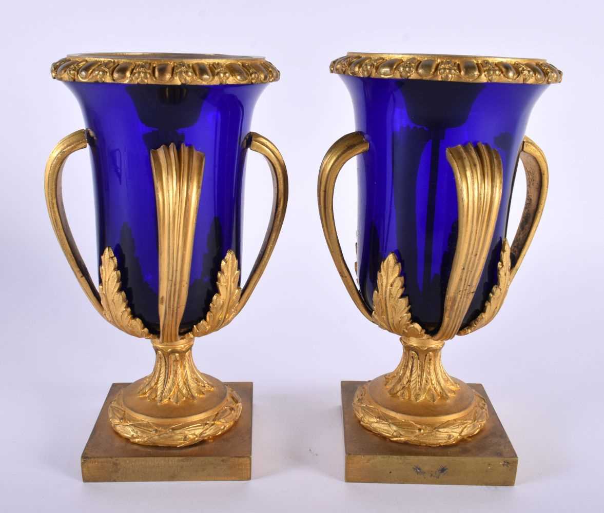 A LOVELY PAIR OF EARLY 19TH CENTURY FRENCH BLUE GLASS EMPIRE ORMOLU VASES modelled upon acanthus - Image 2 of 7