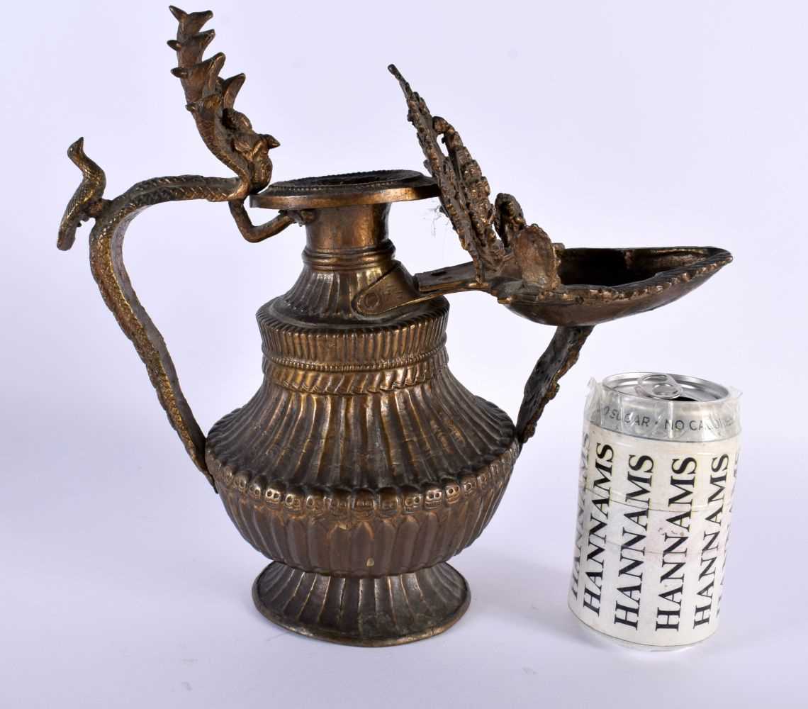 A RARE 18TH/19TH CENTURY TIBETAN NEPALESE BRONZE SUKUNDA LAMP the body decorated all over with